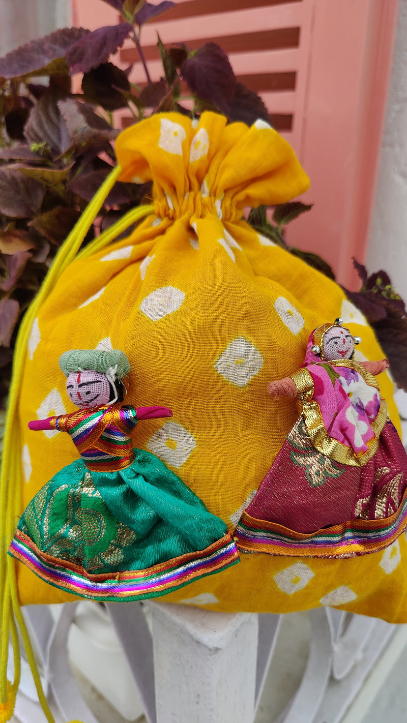 YELLOW BANDHINI COTTON POTLI BAG WITH HAND MADE PUPPETS