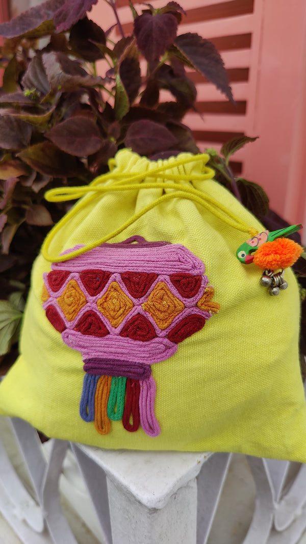 YELLOW COTTON POTLI BAG WITH HAND DONE THREAD WORK
